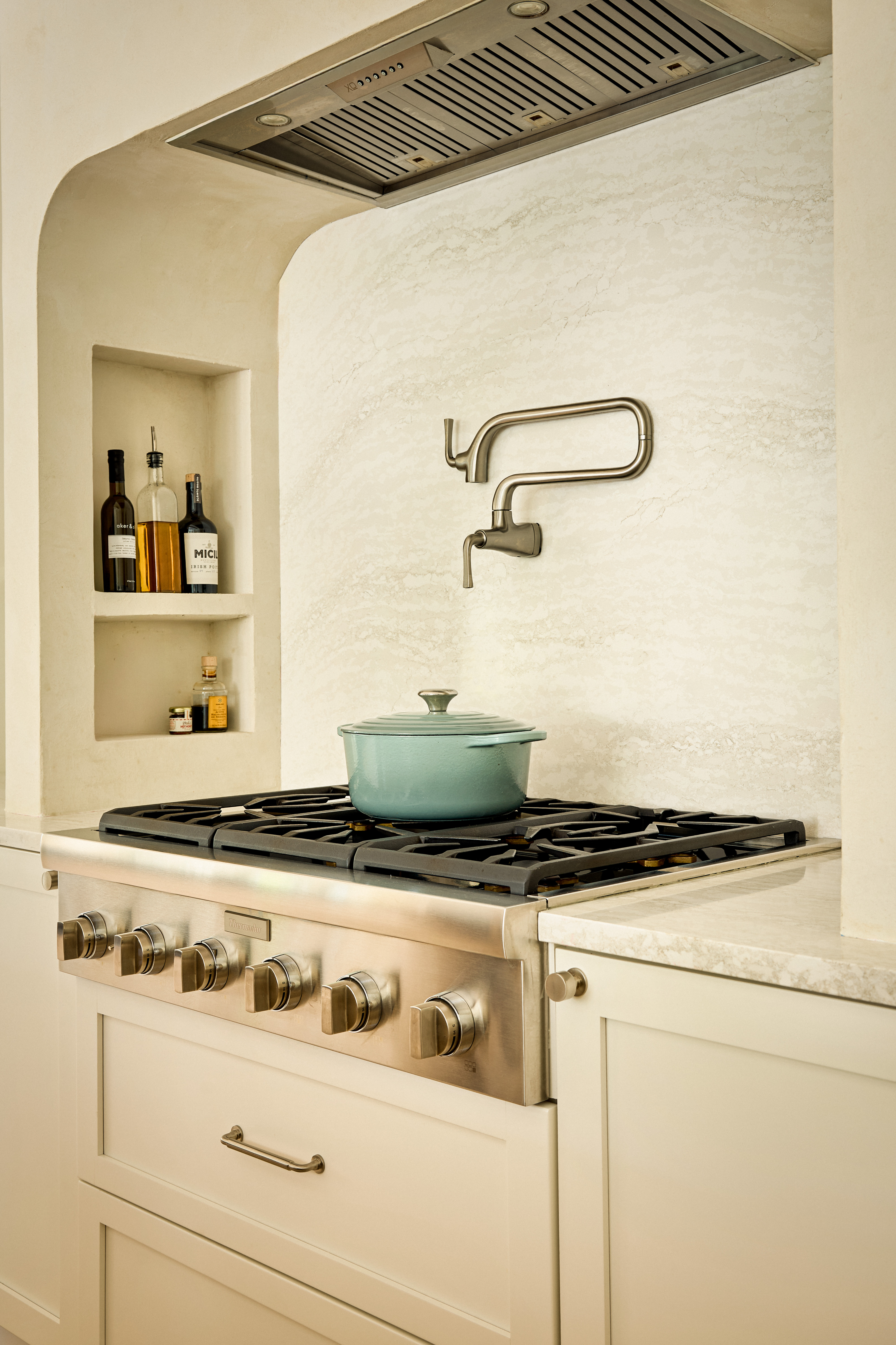 Professional range with pot filler — kitchen detail photography